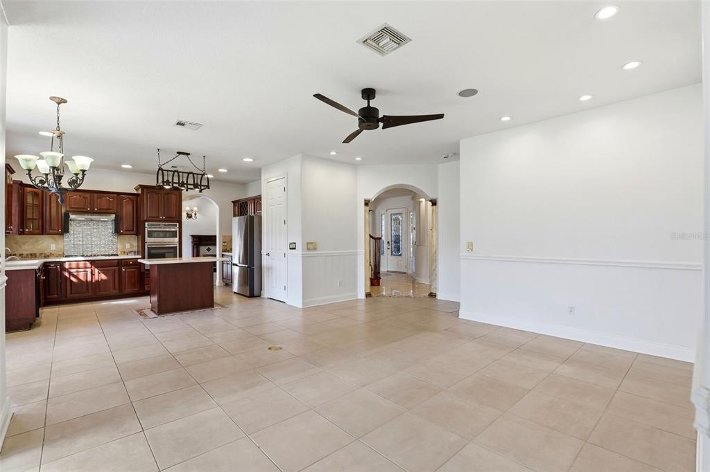 93 Braelock Drive Ocoee, FL 34761 - Photo 18 of 58 a view of a room with kitchen and living room