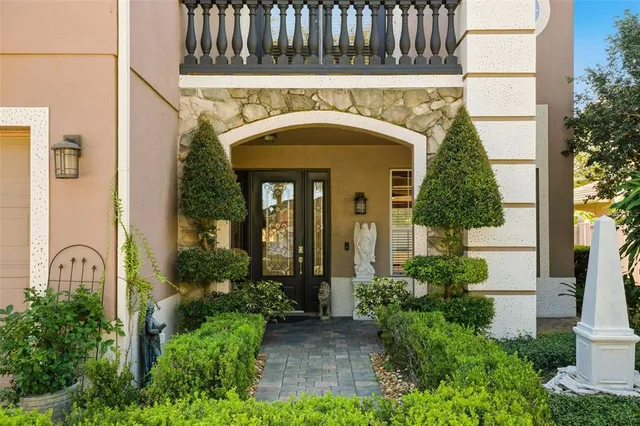 a front view of a house with garden