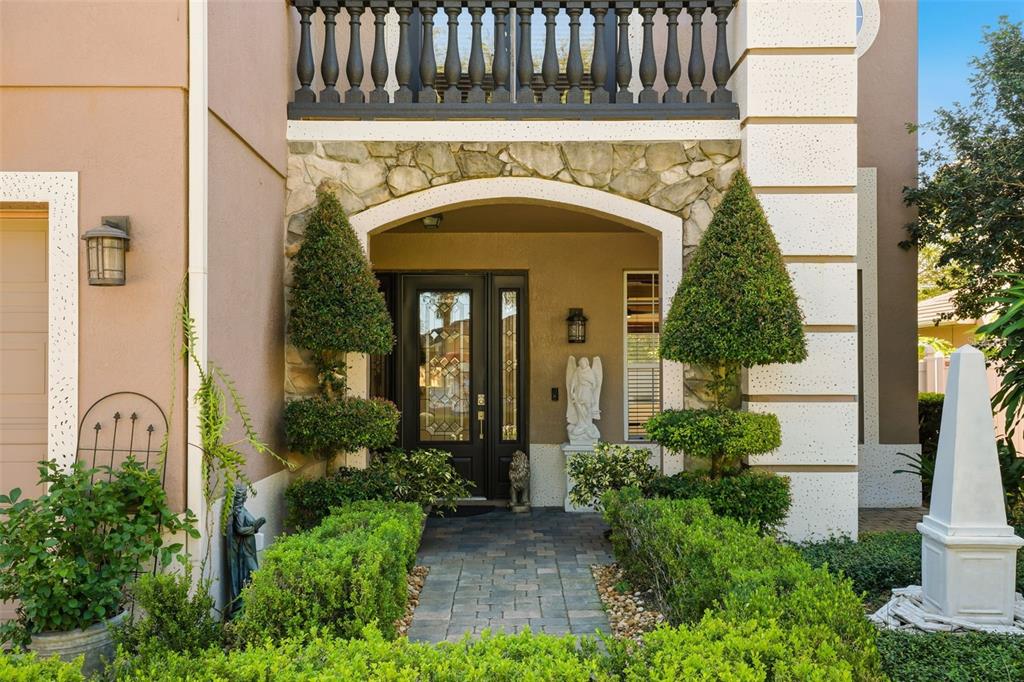 93 Braelock Drive Ocoee, FL 34761 - Photo 3 of 58 a front view of a house with garden