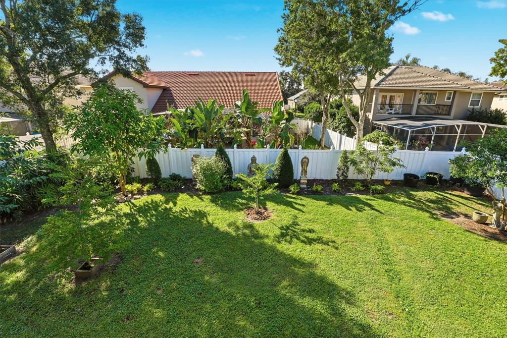 93 Braelock Drive Ocoee, FL 34761 - Photo 33 of 58 a view of a house with a garden and yard