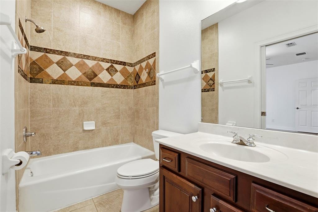 93 Braelock Drive Ocoee, FL 34761 - Photo 35 of 58 a bathroom with a sink a toilet and shower