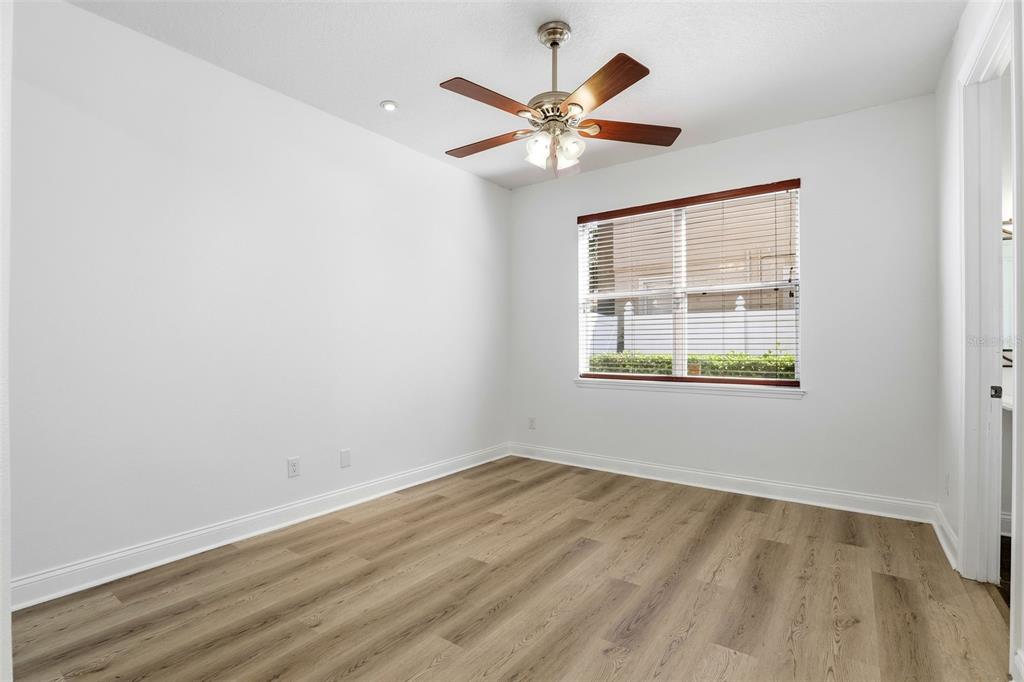93 Braelock Drive Ocoee, FL 34761 - Photo 39 of 58 wooden floor in an empty room with a window