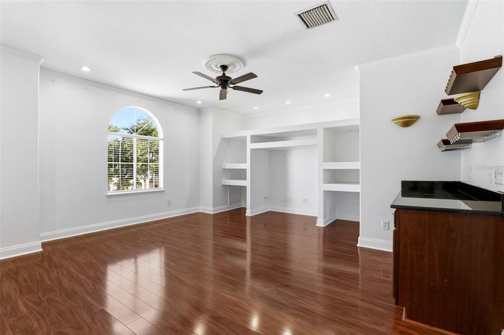 93 Braelock Drive Ocoee, FL 34761 - Photo 40 of 58 a view of empty room with wooden floor and windows