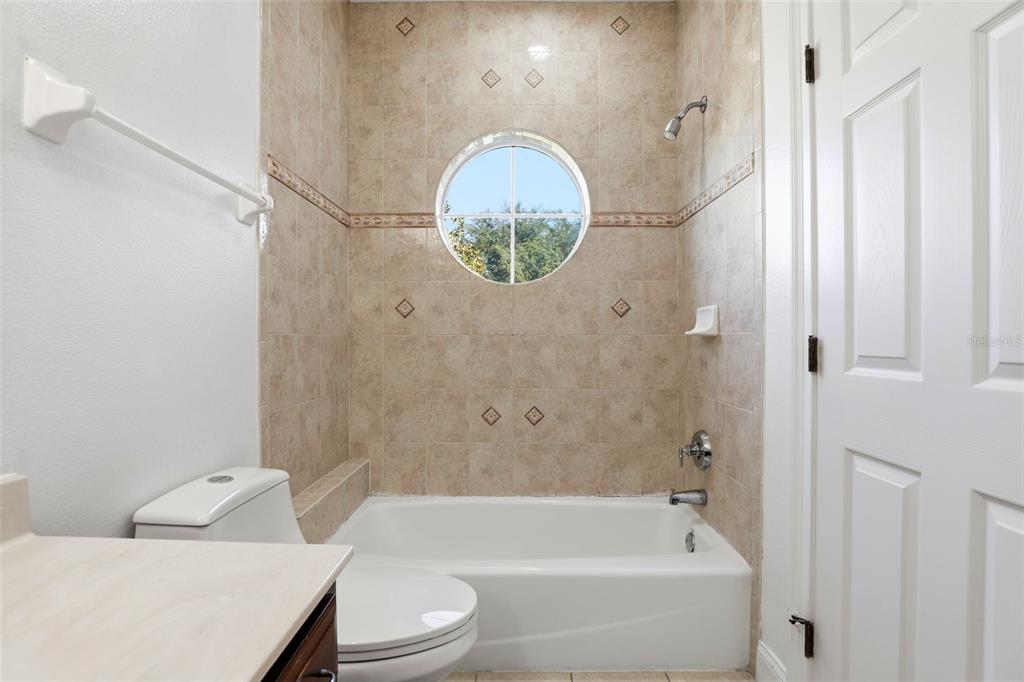 93 Braelock Drive Ocoee, FL 34761 - Photo 43 of 58 a bathroom with a toilet and a bathtub