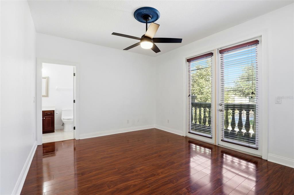 93 Braelock Drive Ocoee, FL 34761 - Photo 44 of 58 a view of an empty room with window and wooden floor