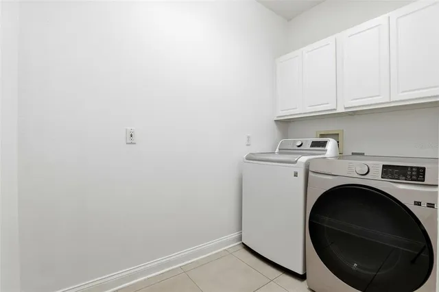 a front view of a house with a yard table and chairs