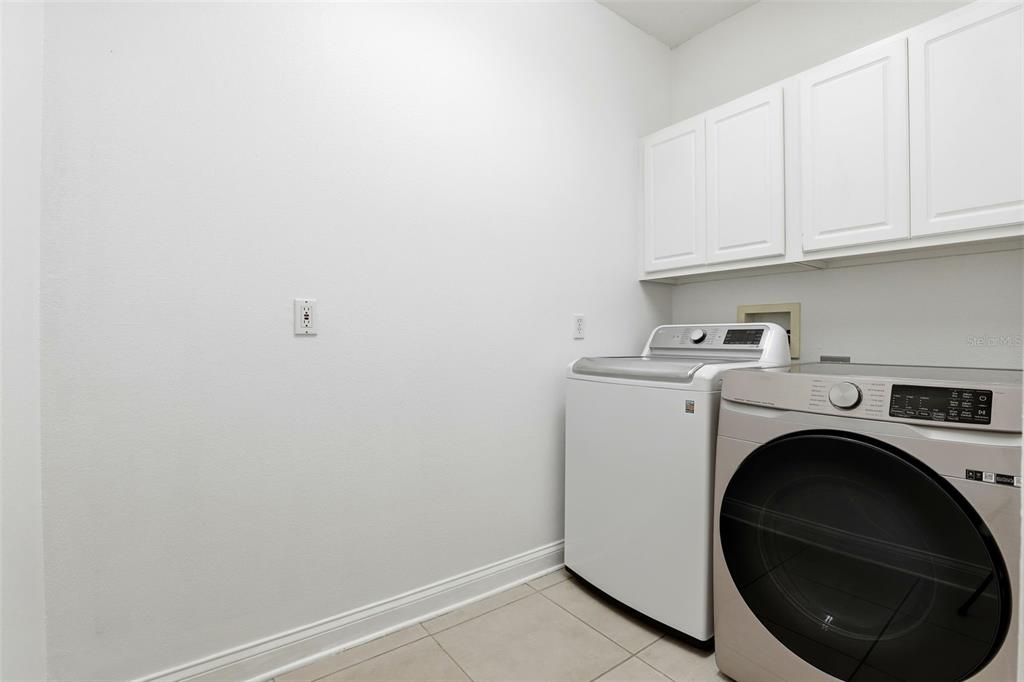 93 Braelock Drive Ocoee, FL 34761 - Photo 45 of 58 a utility room with dryer and washer