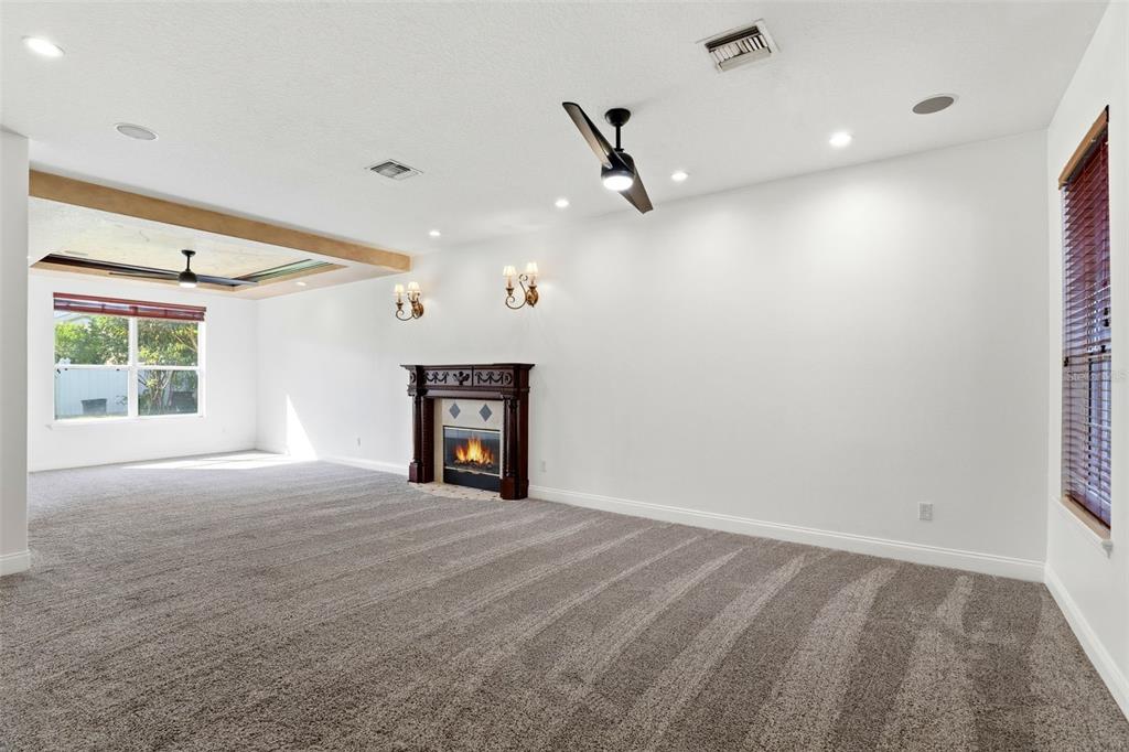 93 Braelock Drive Ocoee, FL 34761 - Photo 5 of 58 en empty room with windows and ceiling fan