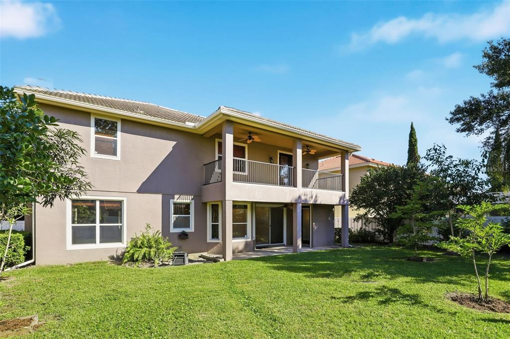 93 Braelock Drive Ocoee, FL 34761 - Photo 51 of 58 a front view of a house with a yard table and chairs
