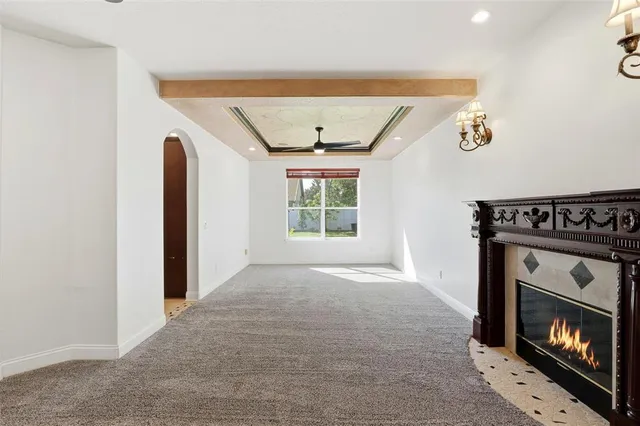 a spacious bedroom with a large bed and a window