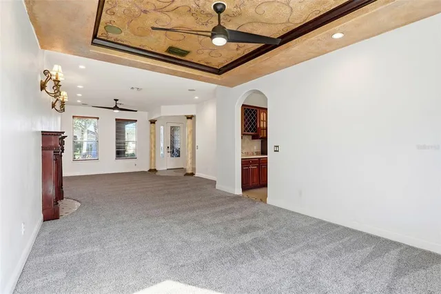 a view of an empty room with a fireplace