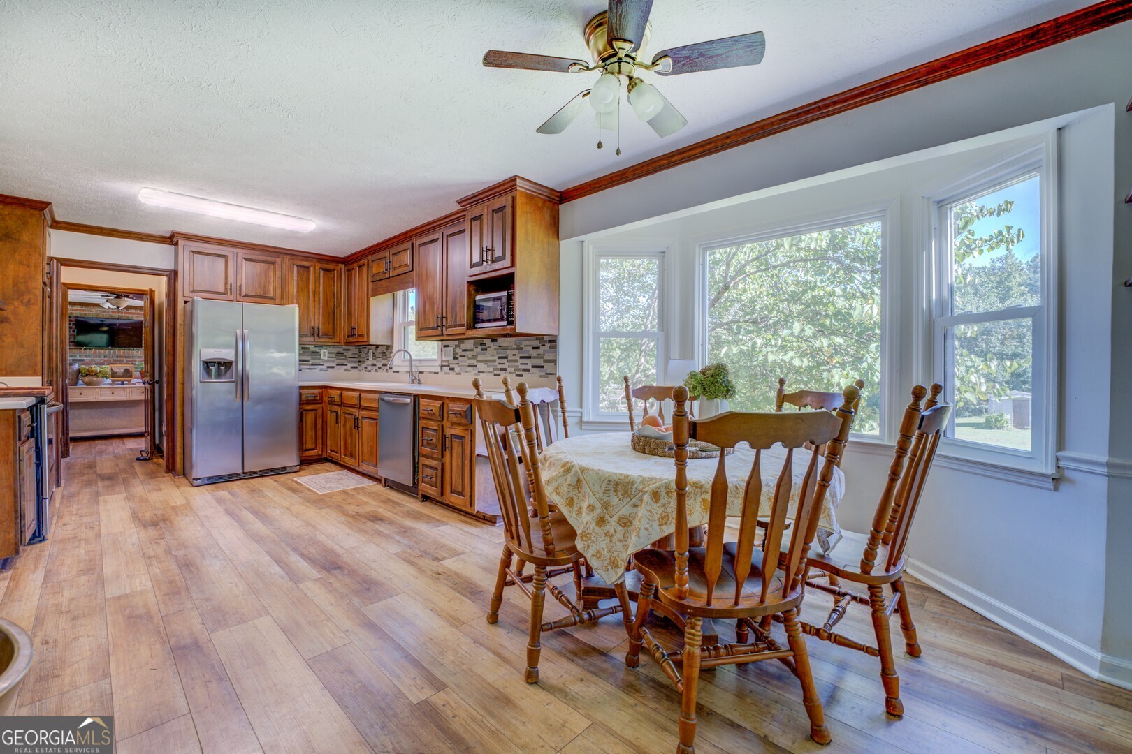 369 Parker Road McDonough, GA 30252 - Photo 12 of 19 a view of a dining room with furniture window and wooden floor