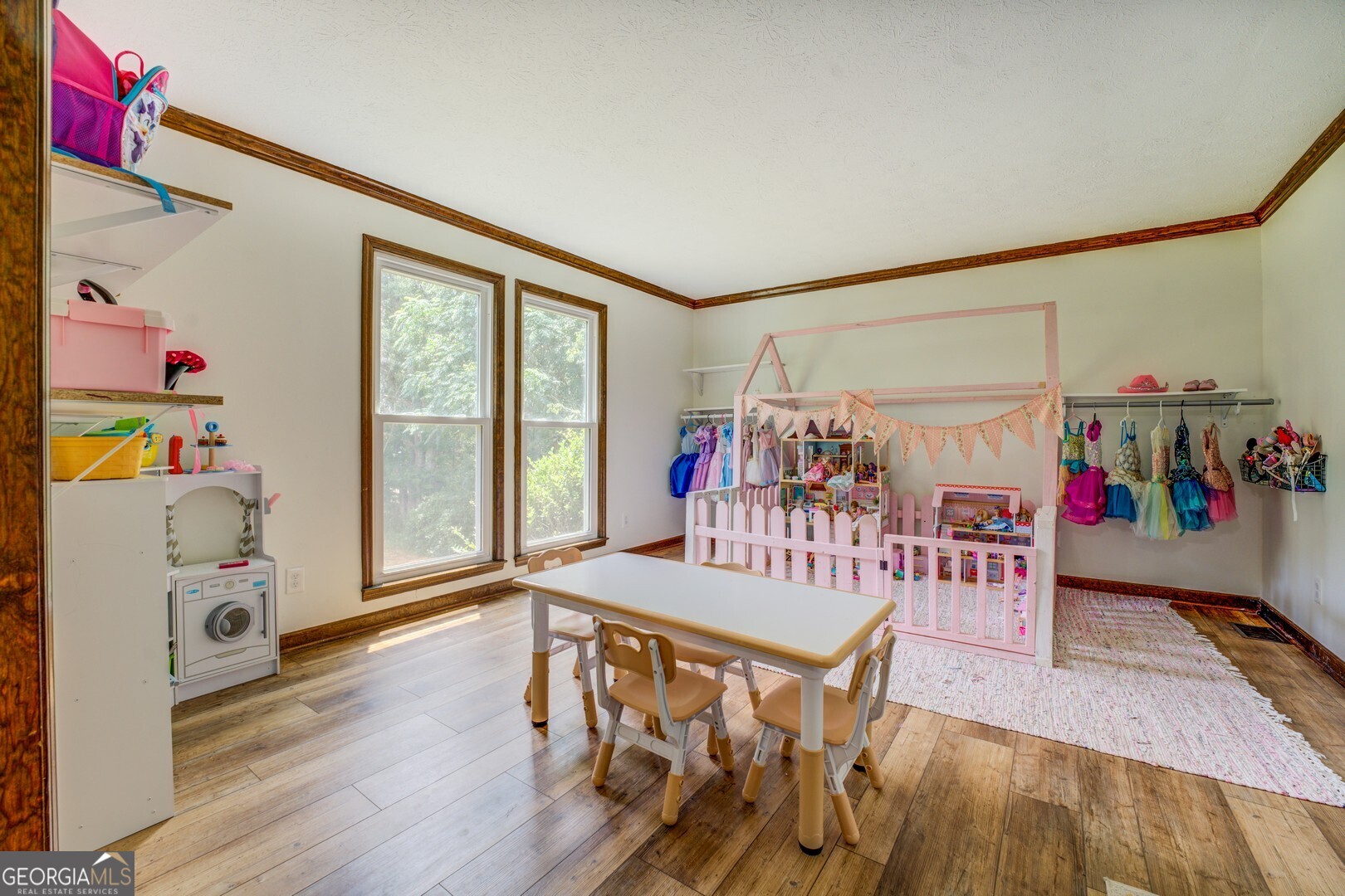 369 Parker Road McDonough, GA 30252 - Photo 14 of 19 a bedroom with furniture and a wooden floor