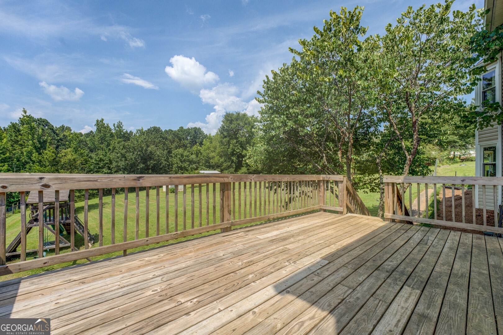 369 Parker Road McDonough, GA 30252 - Photo 19 of 19 a view of balcony with wooden floor and fence