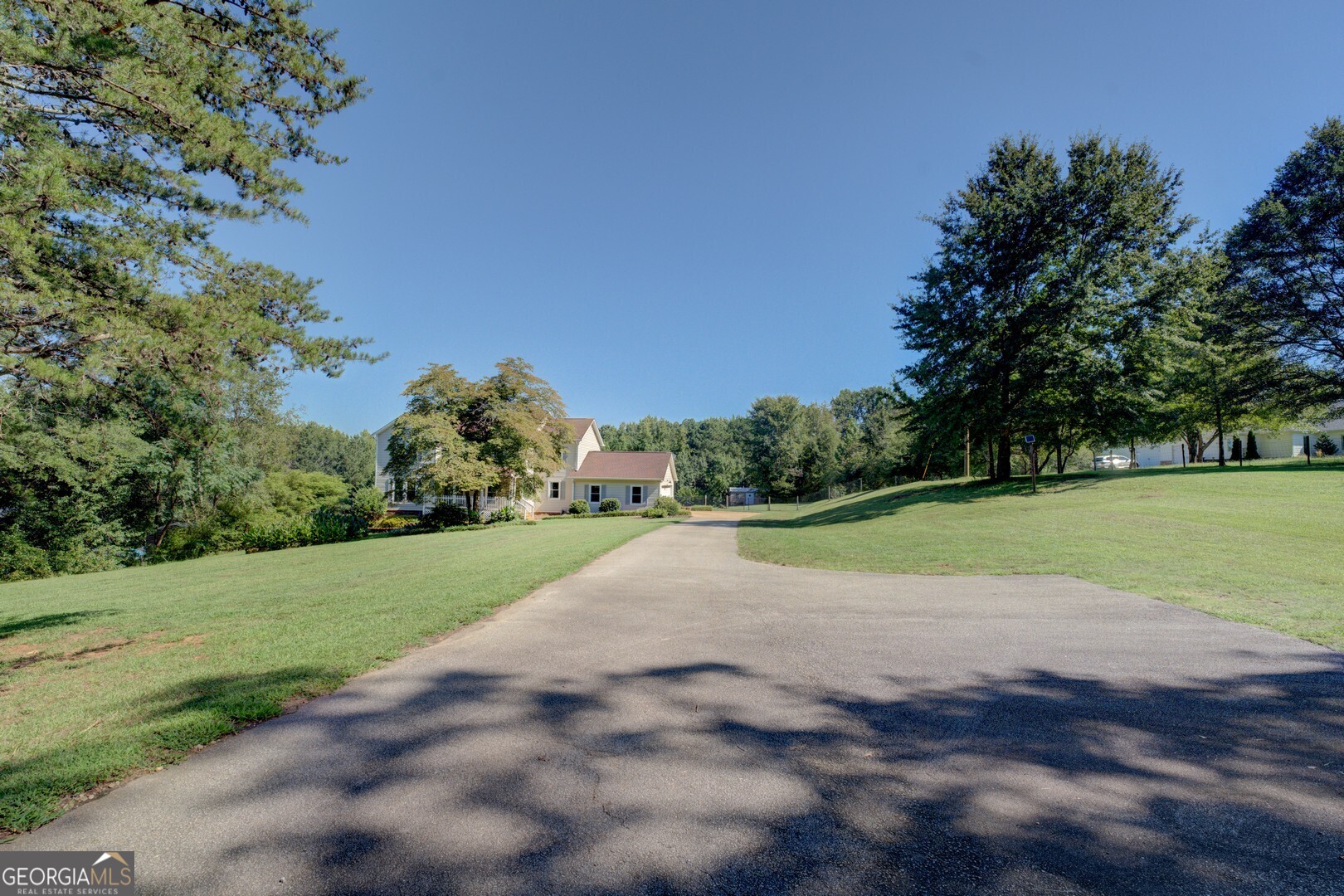 369 Parker Road McDonough, GA 30252 - Photo 2 of 19 a view of a field with grass and trees