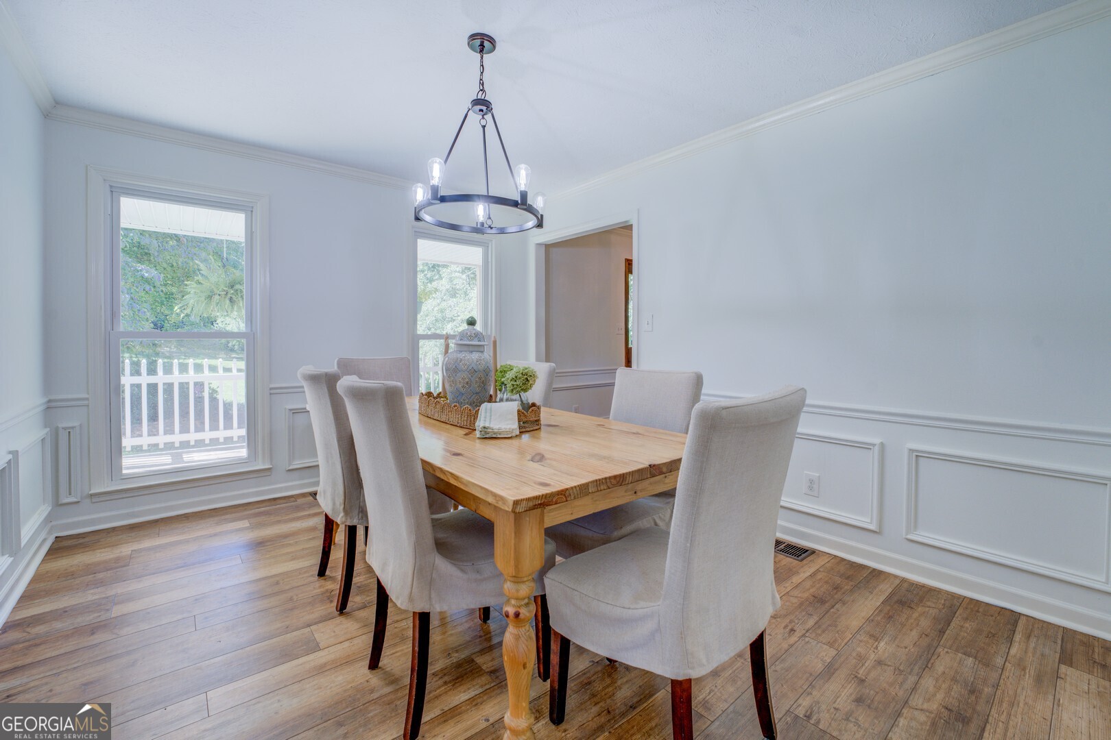 369 Parker Road McDonough, GA 30252 - Photo 4 of 19 a view of a dining room with furniture window and wooden floor
