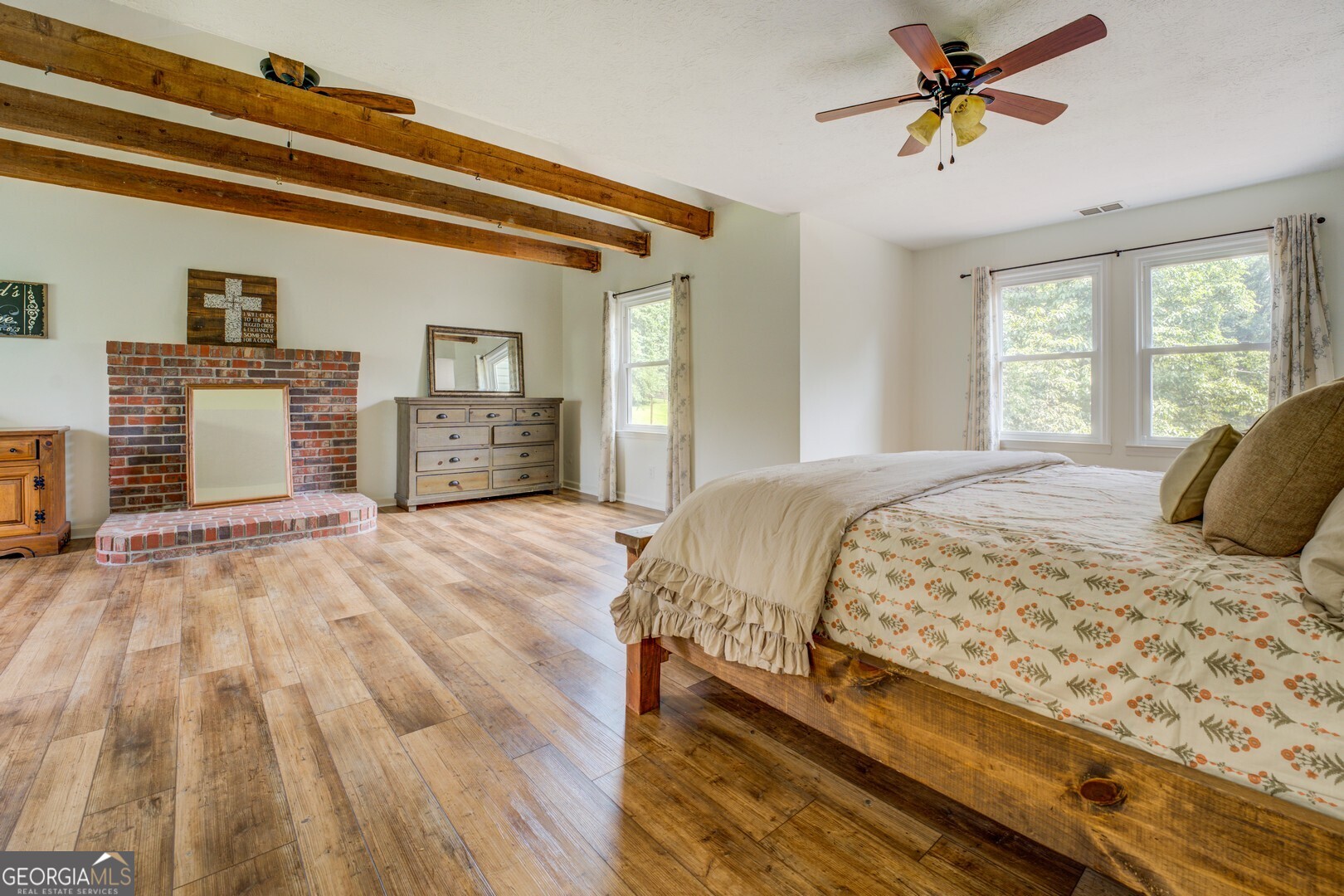 369 Parker Road McDonough, GA 30252 - Photo 5 of 19 a bedroom with a bed and a chandelier