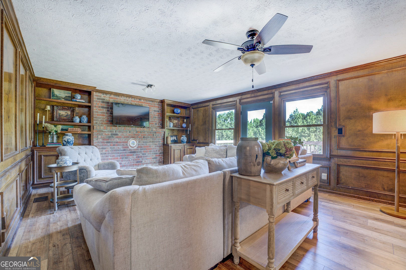 369 Parker Road McDonough, GA 30252 - Photo 6 of 19 a living room with fireplace furniture and a flat screen tv