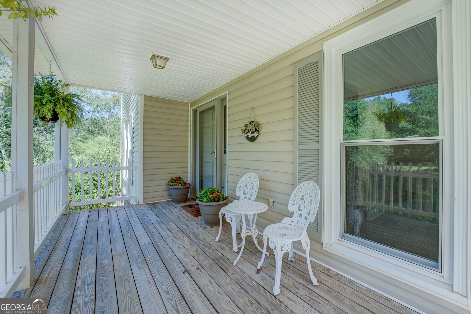 369 Parker Road McDonough, GA 30252 - Photo 7 of 19 a balcony with wooden floor table and chairs