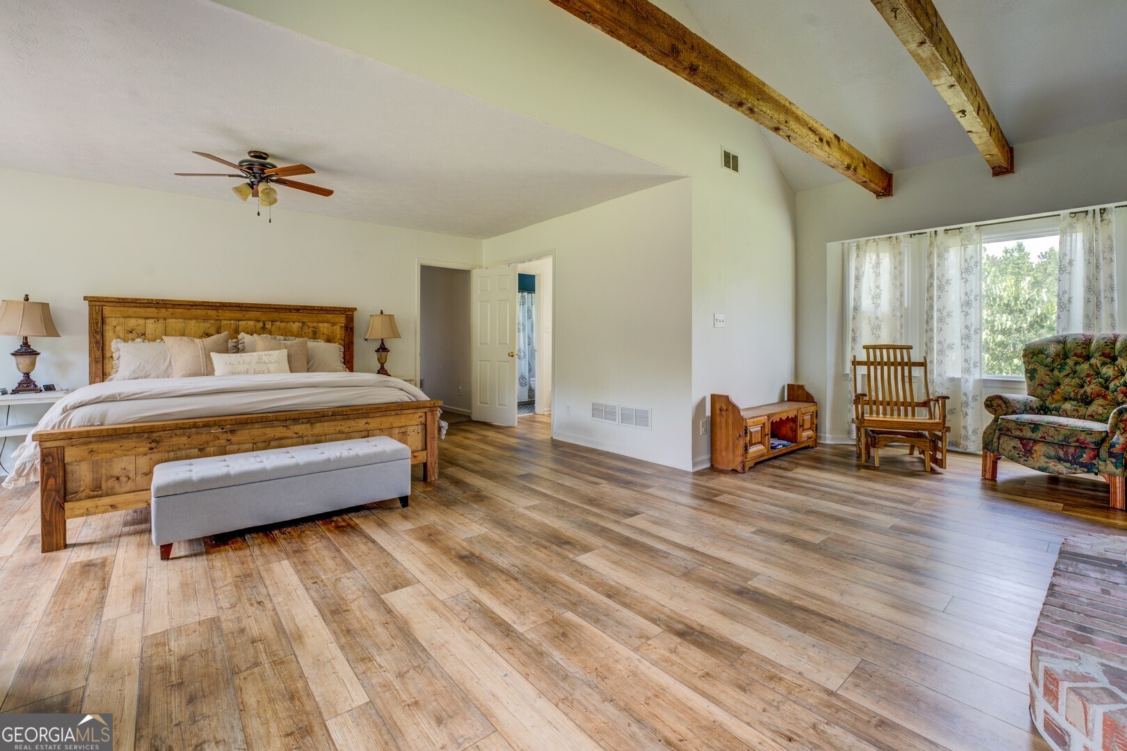 369 Parker Road McDonough, GA 30252 - Photo 10 of 19 a bedroom with furniture and a wooden floor