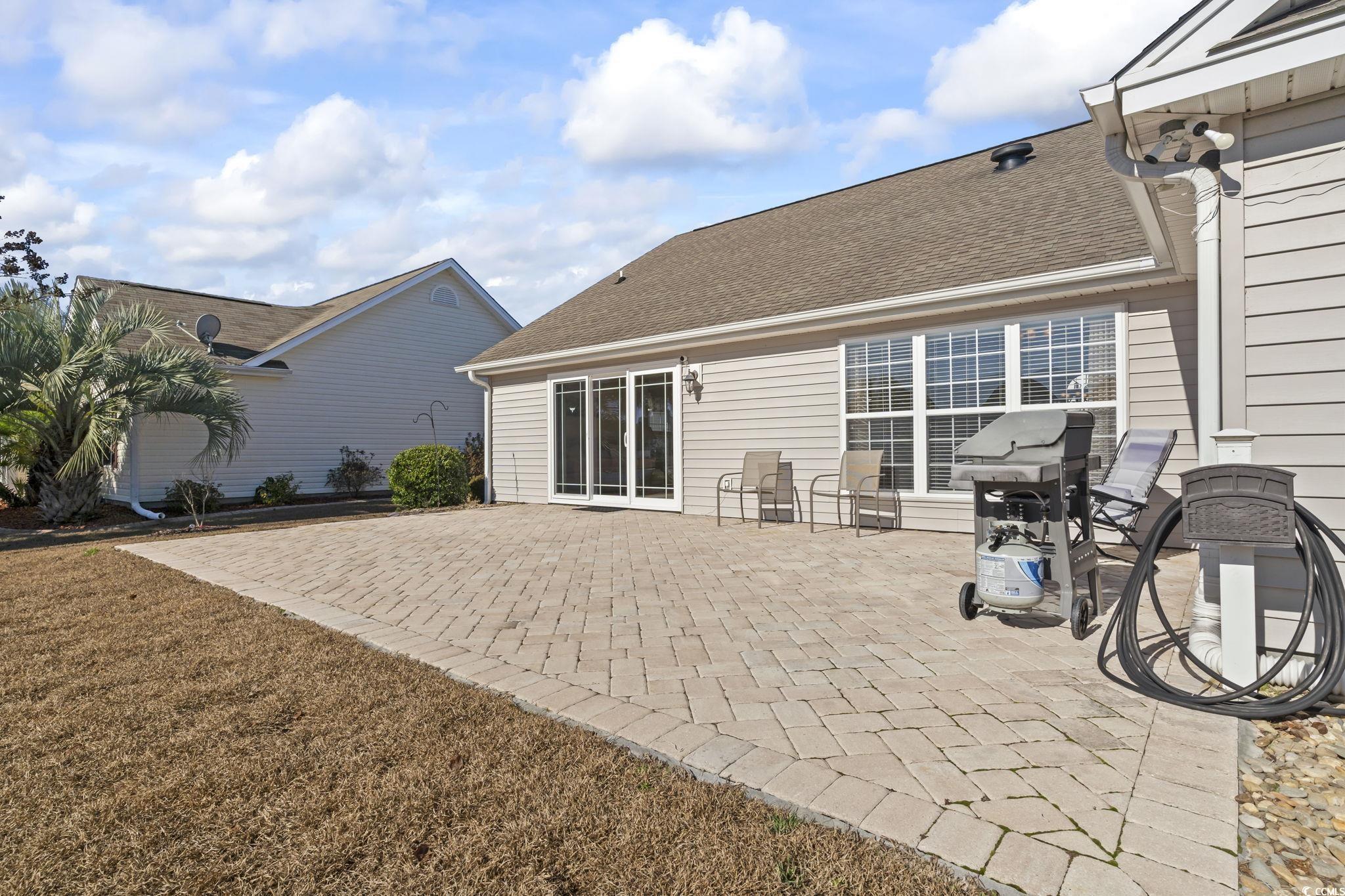 1413 Half Penny Loop Conway, SC 29526 - Photo 34 of 35 View of patio featuring a shed and a grill