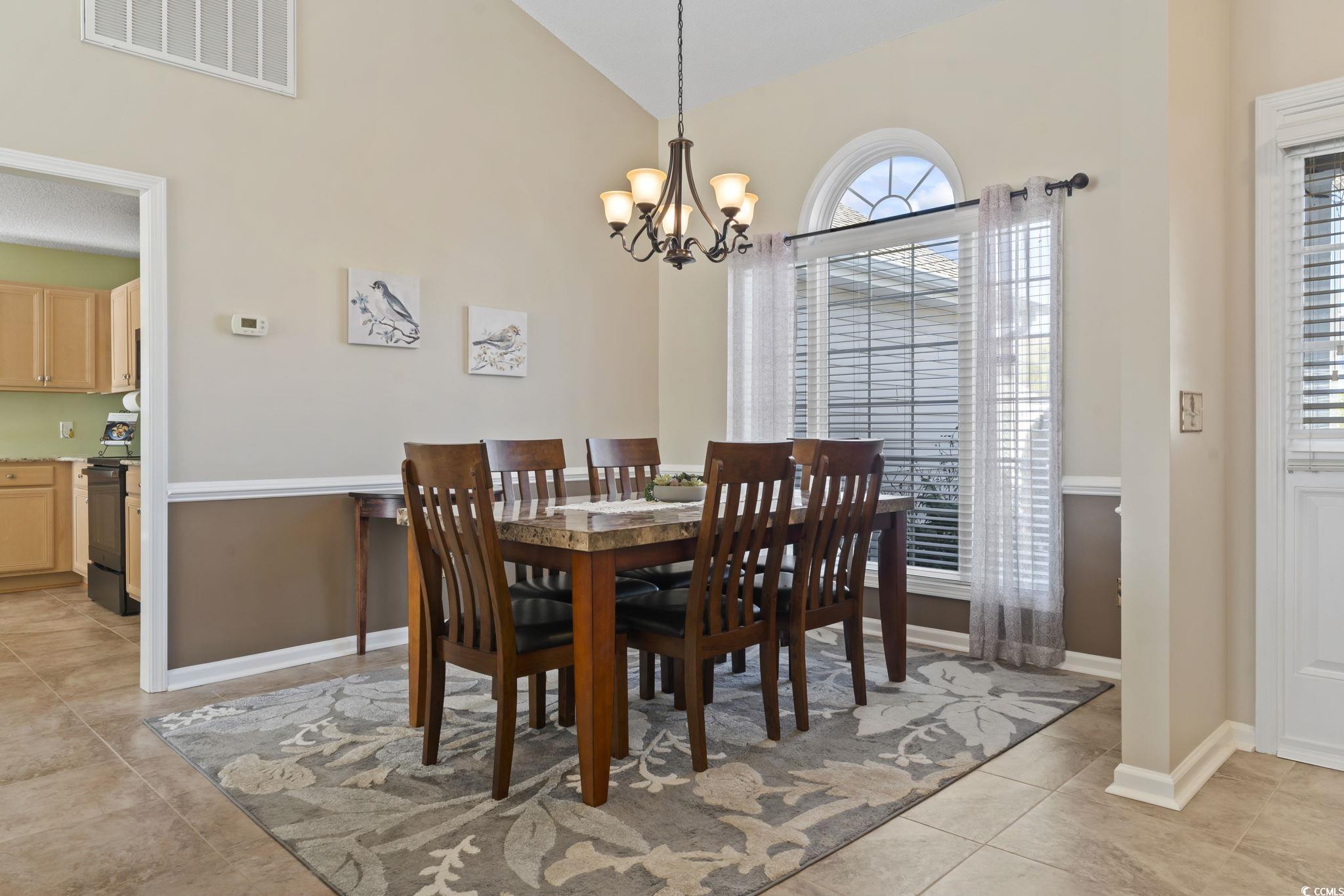 1413 Half Penny Loop Conway, SC 29526 - Photo 8 of 35 Dining space featuring lofted ceiling, light tile