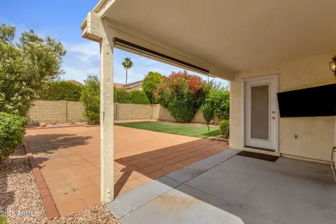 a view of a porch with a floor to ceiling window and an outdoor space