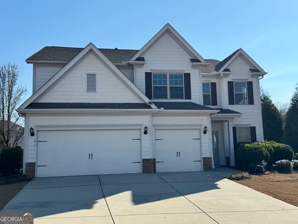 a front view of a house with a garage