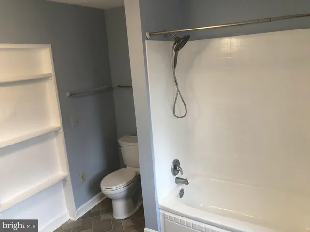 a bathroom with a sink mirror and vanity