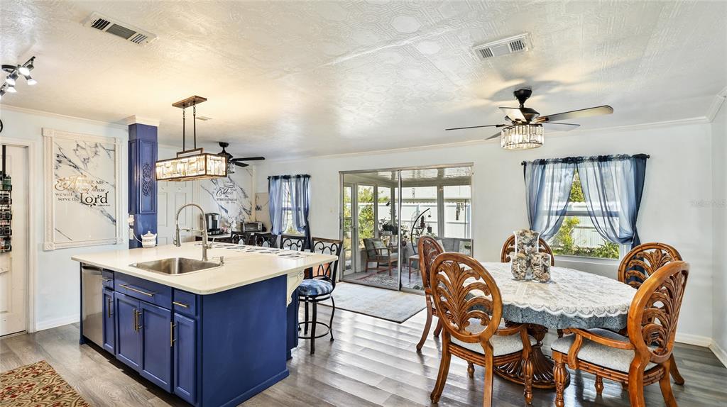13492 Dibella Avenue Port Charlotte, FL 33981 - Photo 11 of 37 a view of a dining room with furniture window and wooden floor