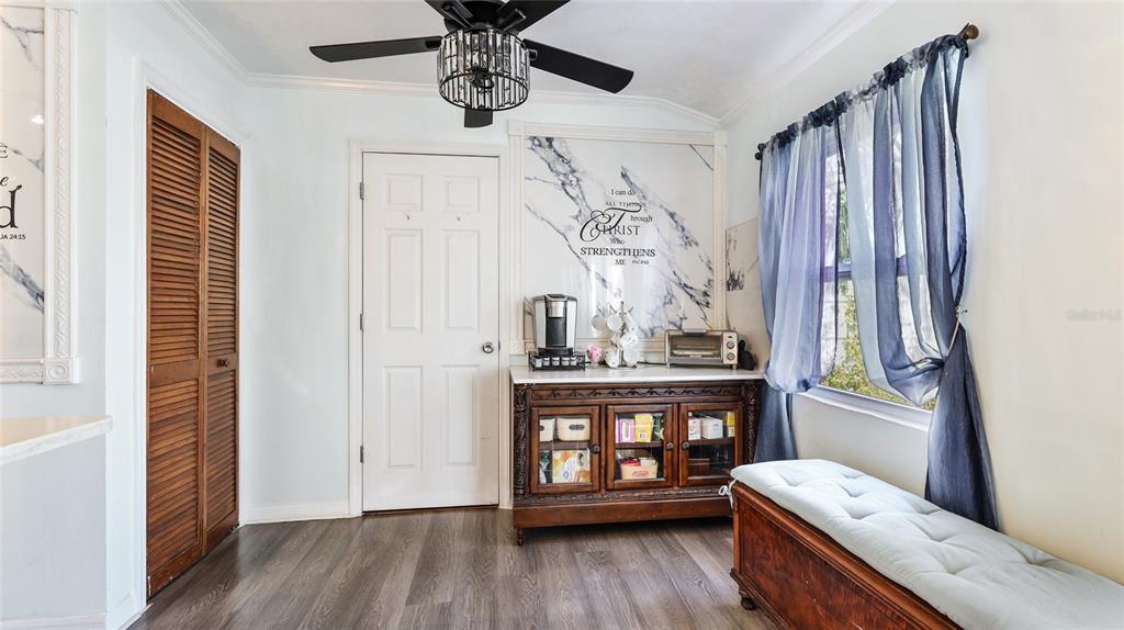 13492 Dibella Avenue Port Charlotte, FL 33981 - Photo 17 of 37 a view of a hallway with wooden floor and entryway