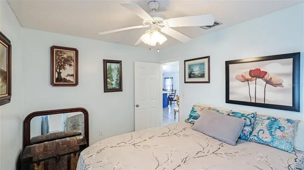 a bedroom with a bed and a couch