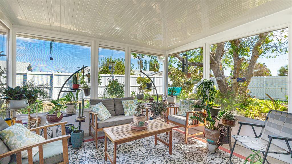 13492 Dibella Avenue Port Charlotte, FL 33981 - Photo 26 of 37 a living room filled with furniture and a potted plant