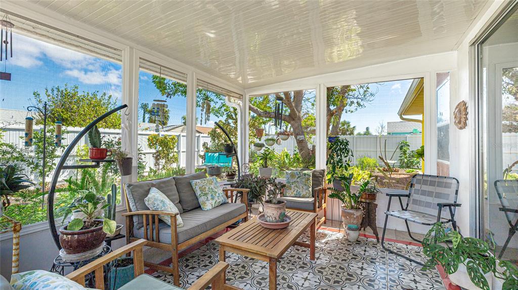 13492 Dibella Avenue Port Charlotte, FL 33981 - Photo 27 of 37 a living room with furniture and a large window
