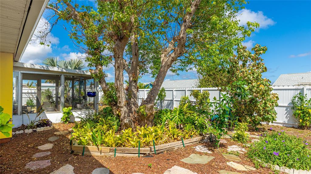 13492 Dibella Avenue Port Charlotte, FL 33981 - Photo 36 of 37 a front view of a house with a yard