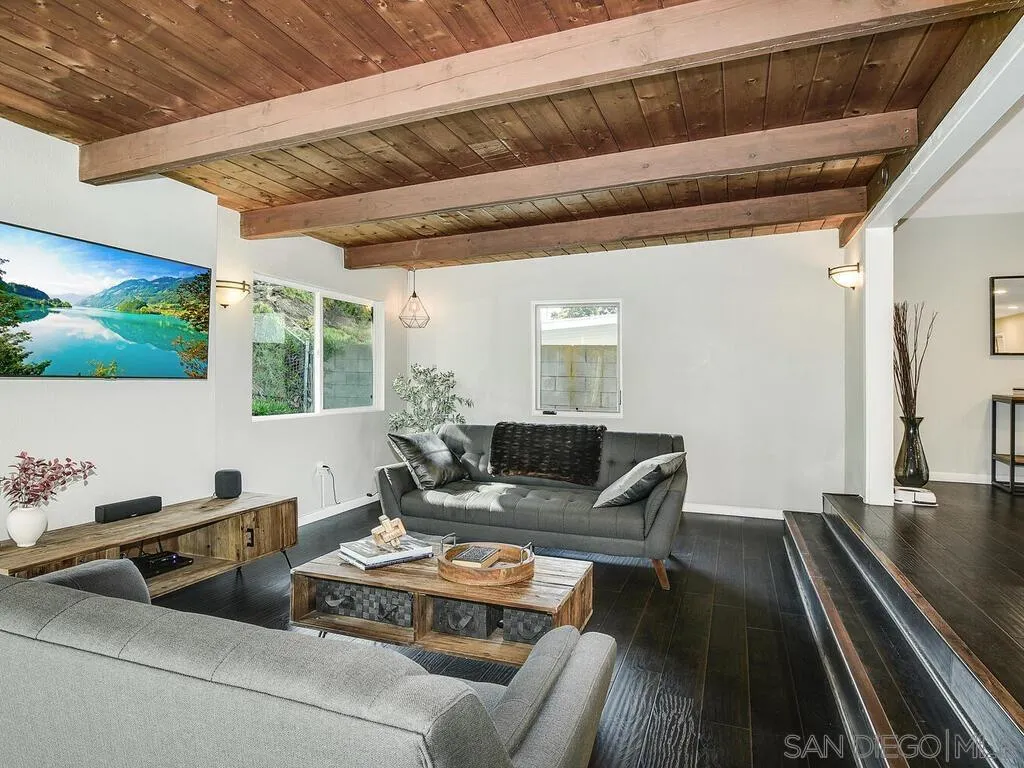 4427 68th Street La Mesa, CA 91942 - Photo 15 of 33 a living room with furniture and a flat screen tv