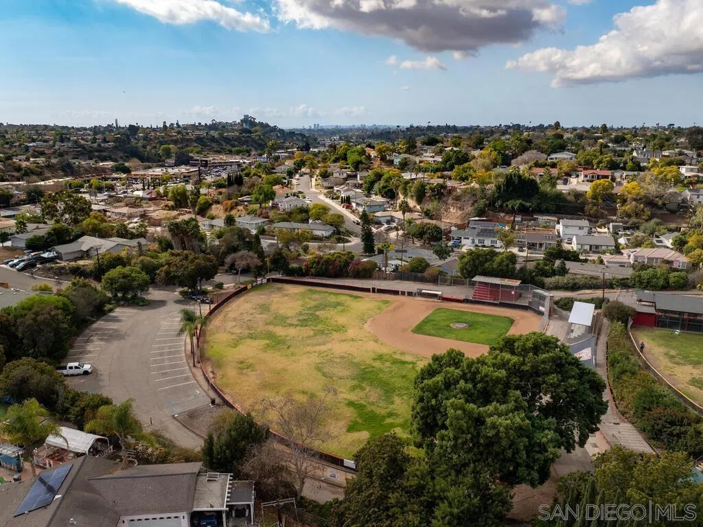 4427 68th Street La Mesa, CA 91942 - Photo 31 of 33 an aerial view of residential houses with outdoor space and swimming pool