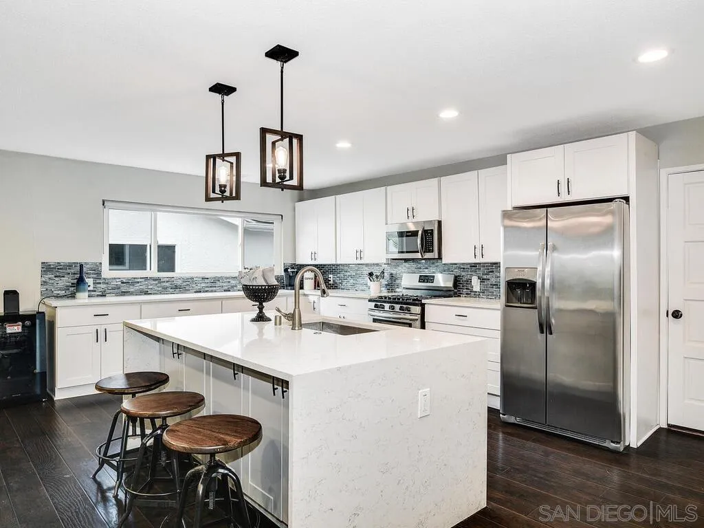 4427 68th Street La Mesa, CA 91942 - Photo 5 of 33 a kitchen with a sink appliances and cabinets
