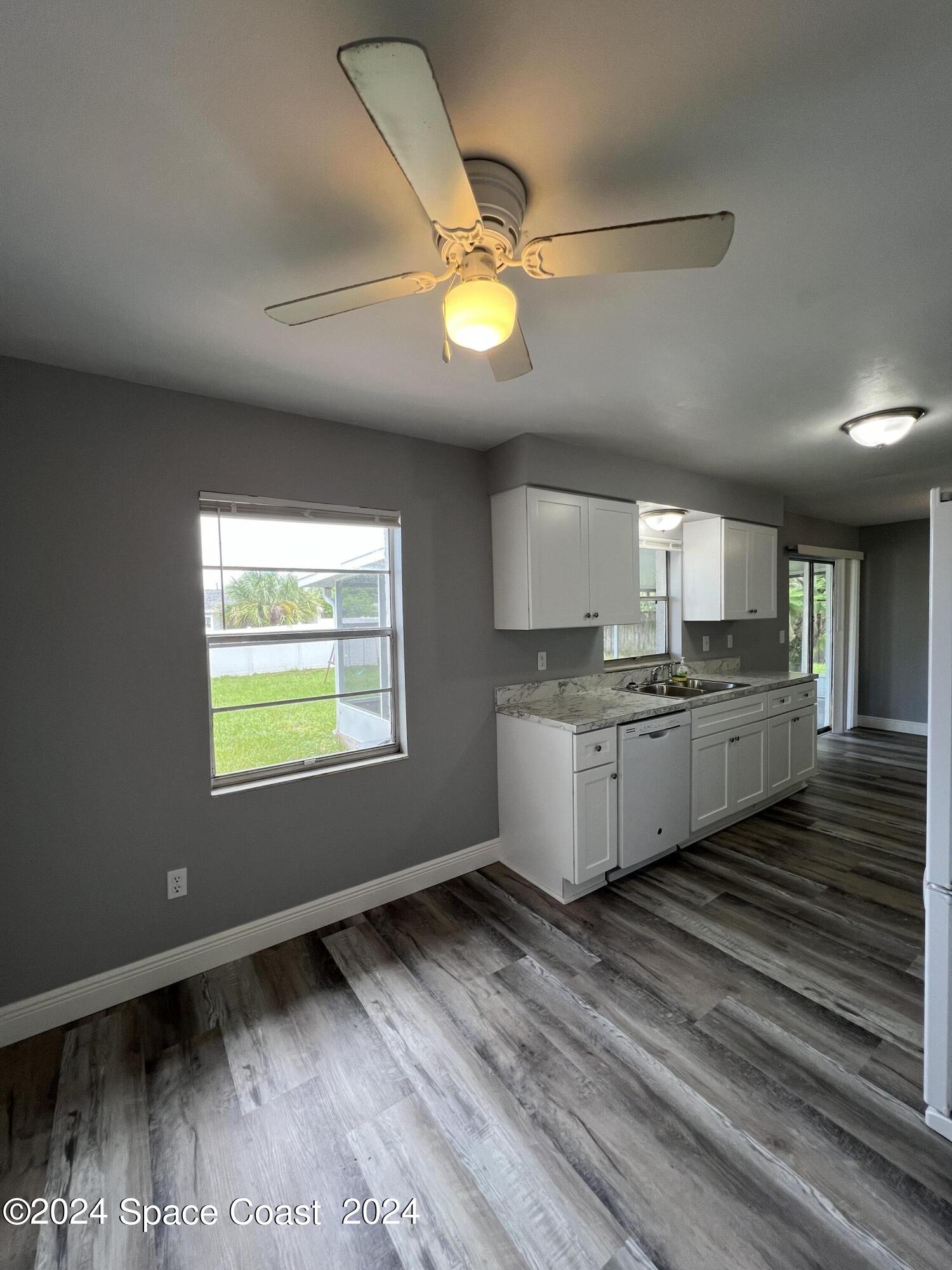 219 Capron Road Cocoa, FL 32927 - Photo 11 of 21 a kitchen with counter top a sink and appliances
