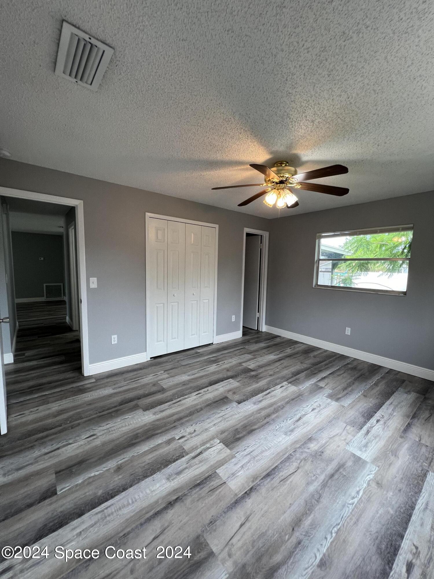 219 Capron Road Cocoa, FL 32927 - Photo 18 of 21 a view of a livingroom with a ceiling fan and window