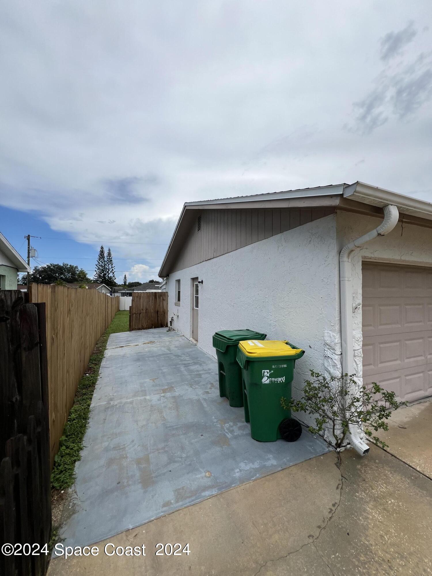 219 Capron Road Cocoa, FL 32927 - Photo 2 of 21 a small pool with a bench in front of house