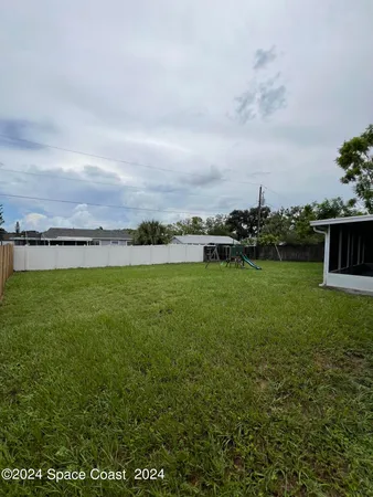 a view of a lake with houses in the back