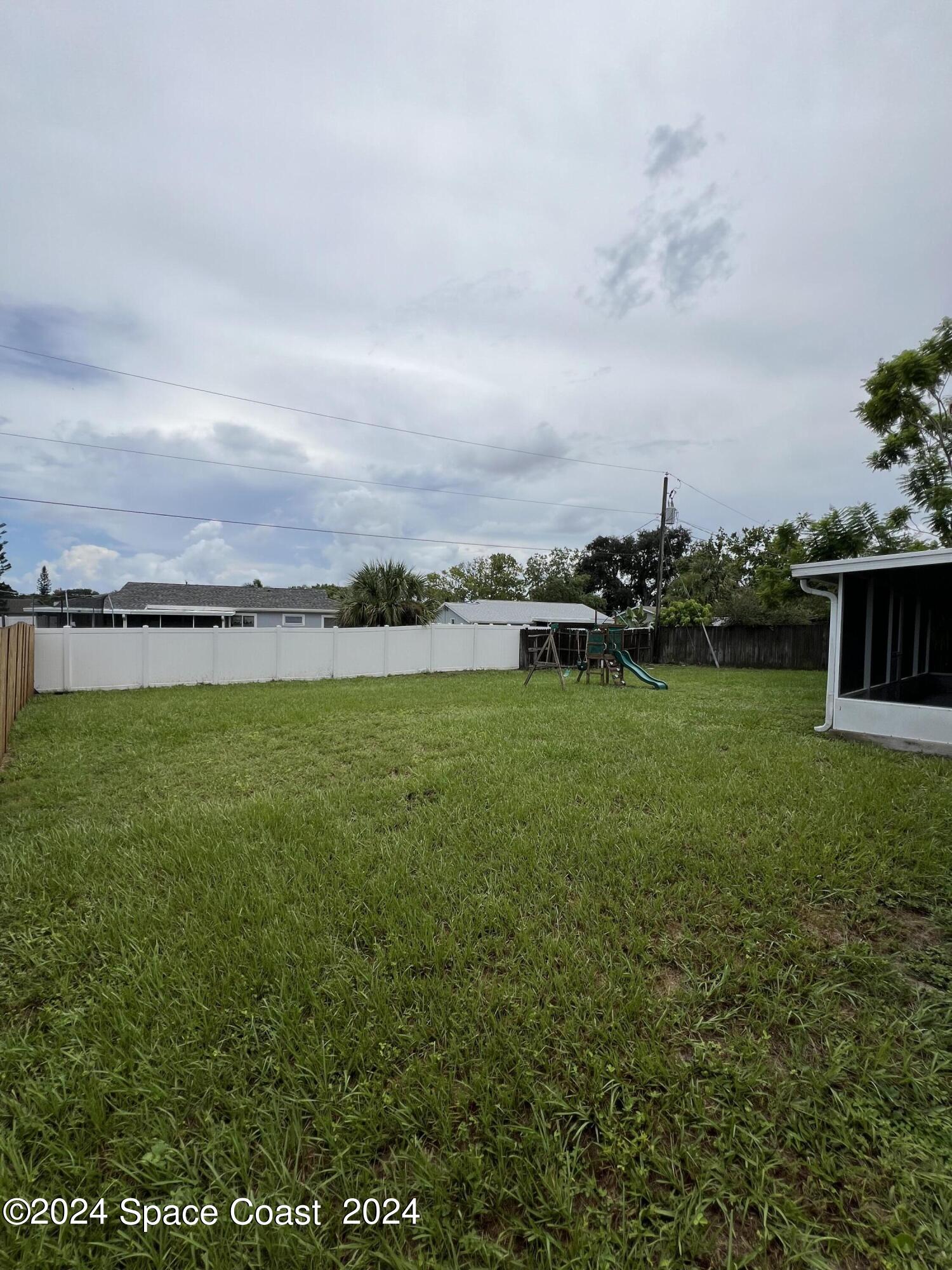 219 Capron Road Cocoa, FL 32927 - Photo 3 of 21 a view of a lake with houses in the back