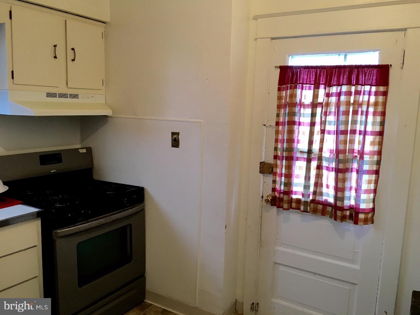 776 Garrett Road Upper Darby, PA 19082 - Photo 11 of 16 a kitchen with a stove and a microwave