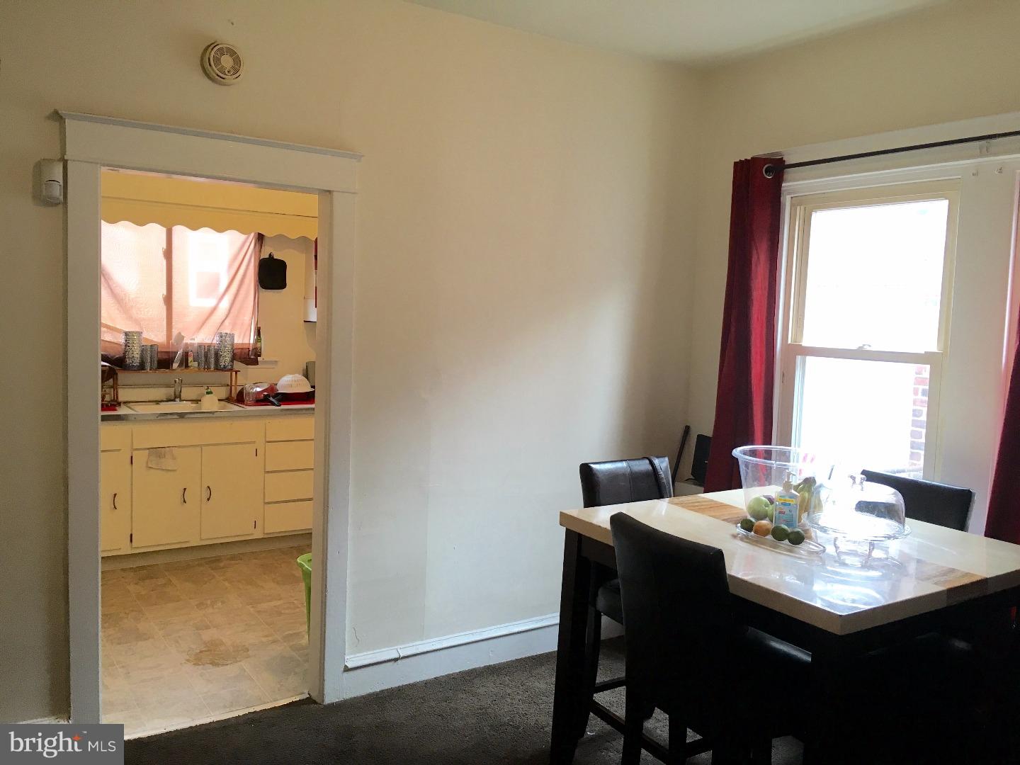 776 Garrett Road Upper Darby, PA 19082 - Photo 13 of 16 a kitchen with a sink cabinets and a dining table