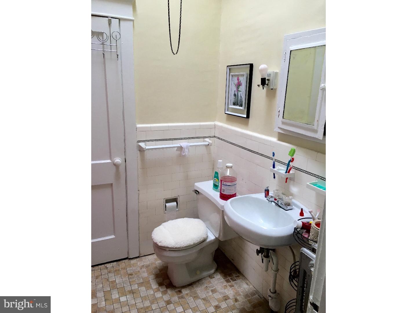 776 Garrett Road Upper Darby, PA 19082 - Photo 14 of 16 a bathroom with a sink toilet and mirror