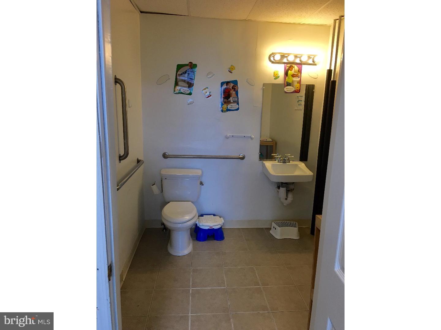 776 Garrett Road Upper Darby, PA 19082 - Photo 9 of 16 a bathroom with a toilet and a shower curtain