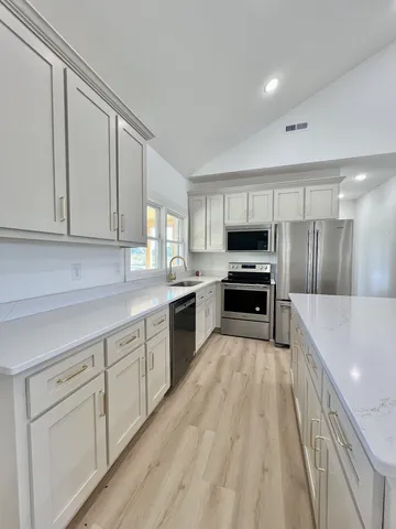 a view of a livingroom with a ceiling fan and window