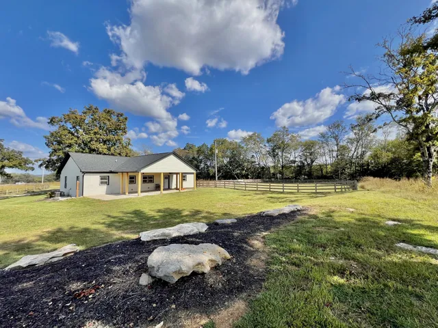 a view of a lake with a big yard