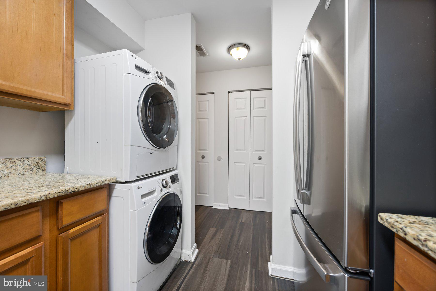 8393 Montgomery Run Road, Unit H Ellicott City, MD 21043 - Photo 16 of 30 a view of a storage and utility room with washer and dryer